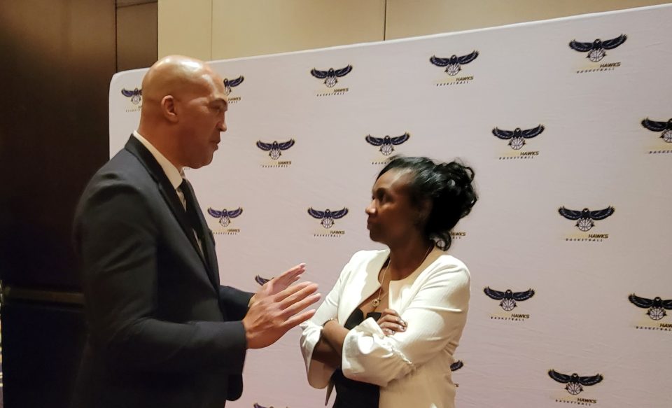 Riverside Hawks board member and basketball agent Jeffrey Ward chatting with NBA G League COO Portia Fultz Archer. (Photo by Derrel Jazz Johnson for rolling out)