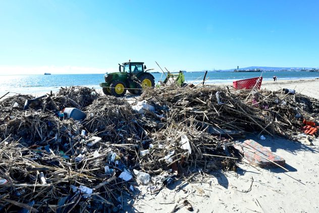 City crews have been busy compiling mounds of trash left along the shoreline following the recent storms in Long Beach, California, on Tuesday, Jan. 17, 2023. After weeks of winter storms that brought flooding rains to California, water hasn't been the only thing flowing into the ocean. BRITTANY MURRAY/ACCUWEATHER