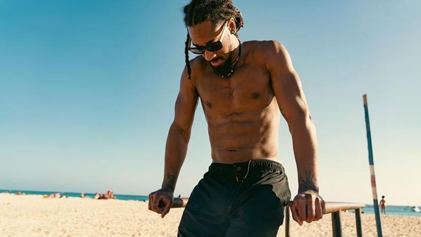Demetrius Andrade flexes his muscles on a beach in California in this file photo. Andrade expects to feel phsycially and mentally healthier with a 8 pound jump to super middleweight. DEMETRIUS ANDRADE