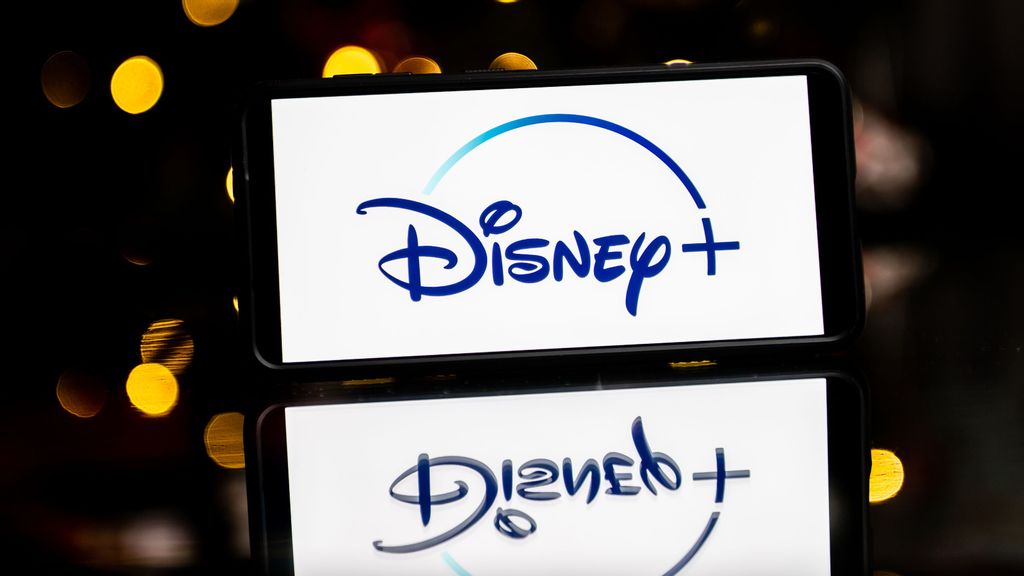 In this photo illustration a Disney + logo seen displayed on a smartphone. The Walt Disney Company had canceled all COVID-19 policies for the company in the company. SOPA IMAGES/BENZINGA
