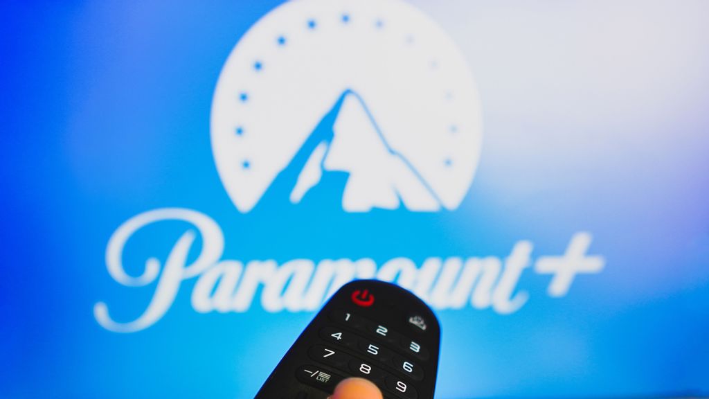 In this photo illustration, a hand holding a TV remote control in front of the Paramount Plus logo on a TV screen. Showtime had been folded into the Paramount+ premium package that is priced at $11.99 per month. RAPHAEL HENRIQUE/GETTY IMAGES
