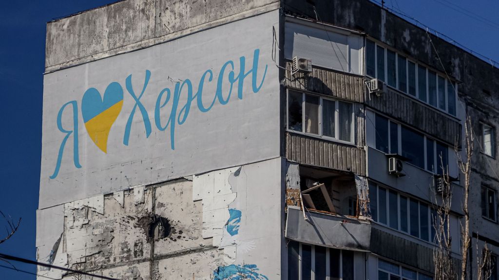 A damaged residenial building in the city of Kherson, with the slogan I love Kherson just above a hole from artillery shelling on March 14, 2023, amid the Russian invasion of Ukraine. A story told of local Kherson native helping his community during the times of war.
