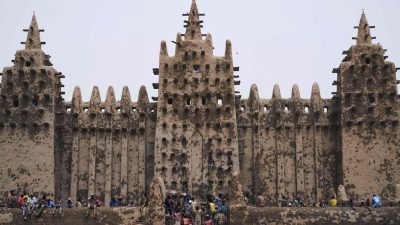 strongPeople take part in the annual rendering of the Great Mosque of Djenne in central Mali on April. 28, 2019. MICHELE CATTANI/AFP/GETTY IMAGES/strong