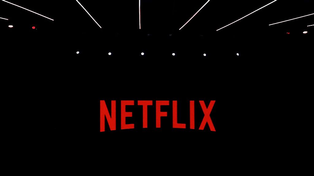 Netflix logo being shown during a keynote about the future of entertainment on the second day of the Mobile World Congress 2023 on February 28, 2023, in Barcelona, Spain. The company will have Saturday morning cartoons and a Stranger Things spinoff. JOAN CROS/BENZINGA