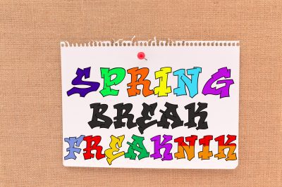 Spring,Break,Freaknik,Written,On,Paper,Sign,Hung,With,Thumb
