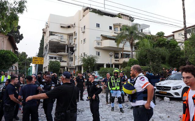 Police at the scene where a rocket fired from Gaza into Israel, hit and damaged a house in Rehovot on May 11, 2023. (Flash90)