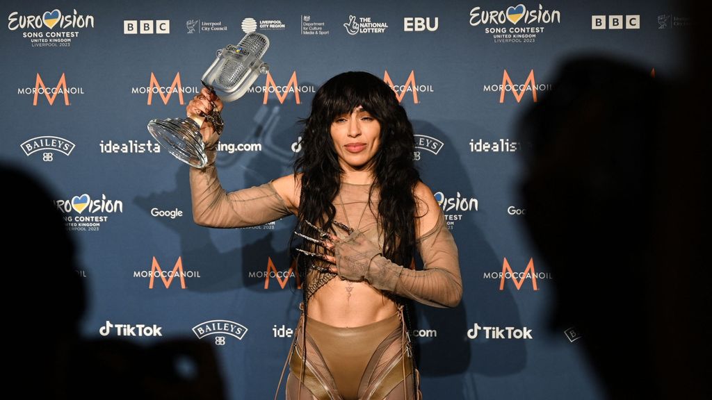 Singer Loreen performing on behalf of Sweden poses with the trophy after winning the final of the Eurovision Song contest 2023 on May 14, 2023 at the M&S Bank Arena in Liverpool, northern England. OLI SCARFF/JNS