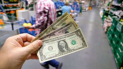 US $ banknotes are seen in a supermarket in Etterbeek on September 2, 2022, in Brussels, Belgium. Western economies are currently experiencing two major shocks that are driving up the costs of goods and services. One women went from a 9-to-5 job to making a passive income of $105,000 a month. THIERRY MONASSE/BENZINGA