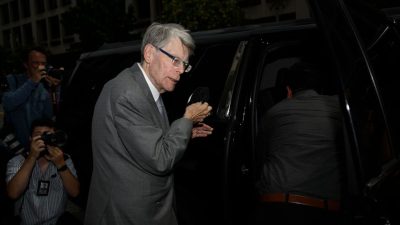 US author Stephen King takes his mask off before entering a vehicle as he departs the US District Court in Washington, DC, on August 2, 2022. - King has called Twitter ‘very strange’ amid the take-over by Elon Musk. MANDEL NGAN/BENZINGA