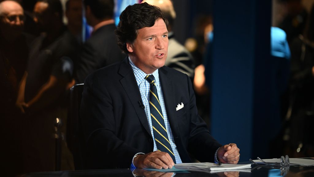 Tucker Carlson speaks during 2022 FOX Nation Patriot Awards at Hard Rock Live at Seminole Hard Rock Hotel & Casino Hollywood on November 17, 2022, in Hollywood, Florida. Carlson interviewed Tate on his show, Tucker On Twitter. (Jason Koerner/Getty Images)