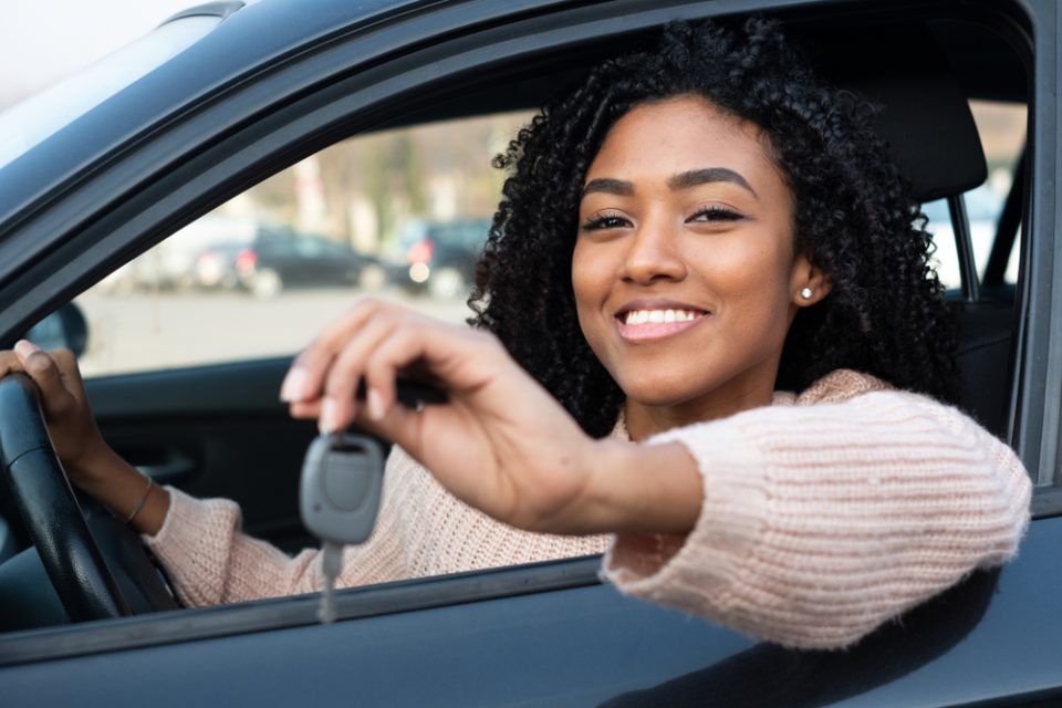 Happy,Young,Black,Woman,Seated,In,Her,New,Car