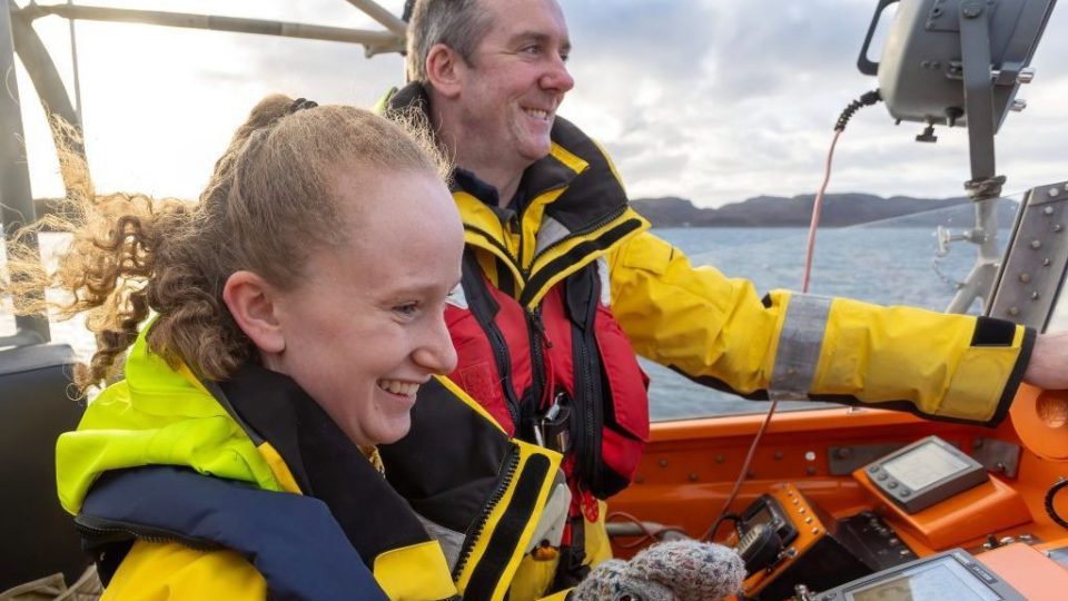 Emma was given the chance to take the helm of the lifeboat. She had gone back to celebrate her 18th Birthday on same lifeboat where she was born. RNLI VIA SWNS.
