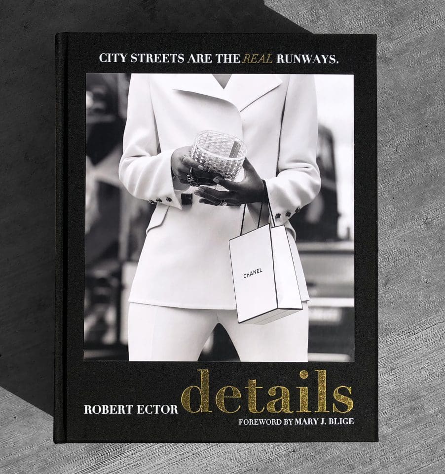 Front cover of Rob Ector’s book, Details, featuring a woman in fashionable white suit.
