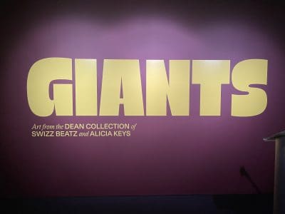 Large yellow letters spell Giants atop a purple backdrop.