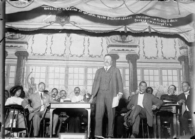 Photo: Former President Theodore Roosevelt speaking at the 11th Annual National Negro Business League Convention in New York City, New York on August 17-19, 1910.