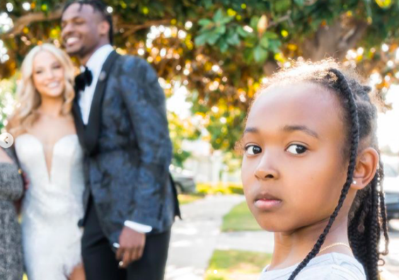 Bronny James with his date as his little sister Zhuri looks on