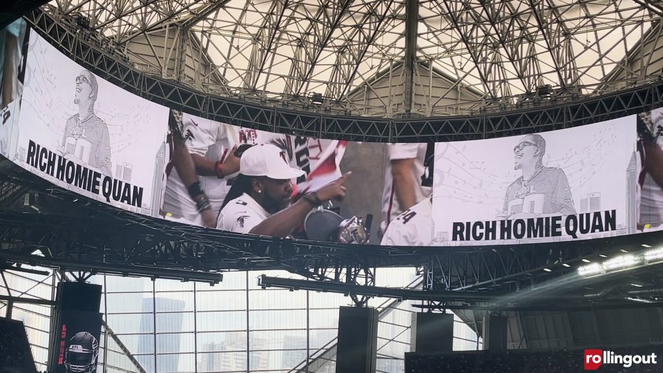 Pastor Troy puts up his index finger during the Atlanta Falcons' tribute to Rich Homie Quan