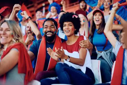 Happy,African,American,Sports,Fan,And,His,Girlfriend,Cheering,For