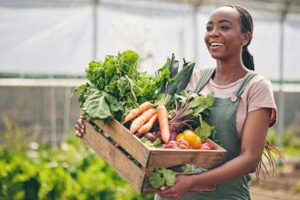 A farmer carrying vegetables