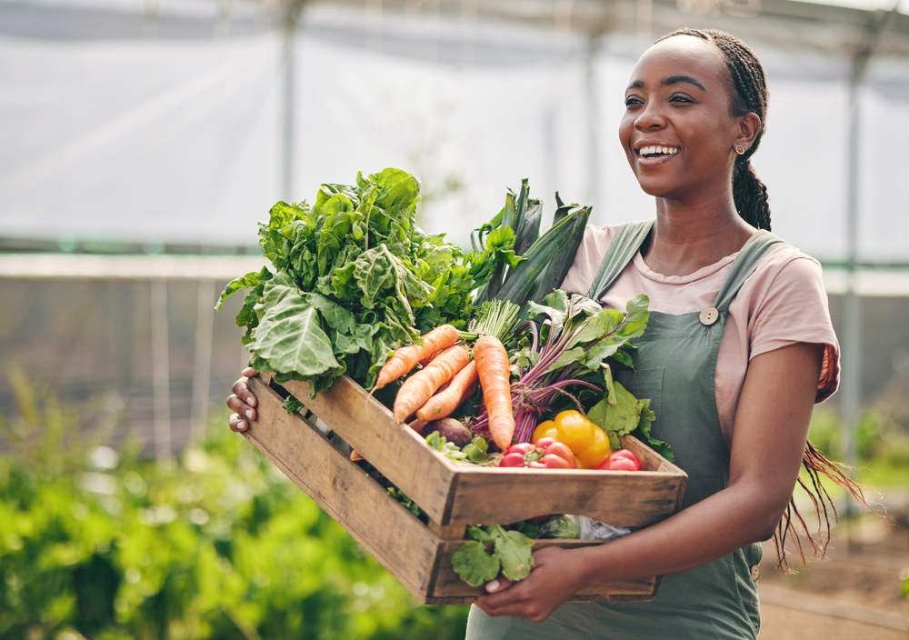 A farmer carrying vegetables