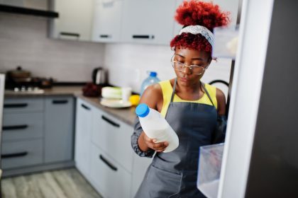 An African American woman looking at raw milk