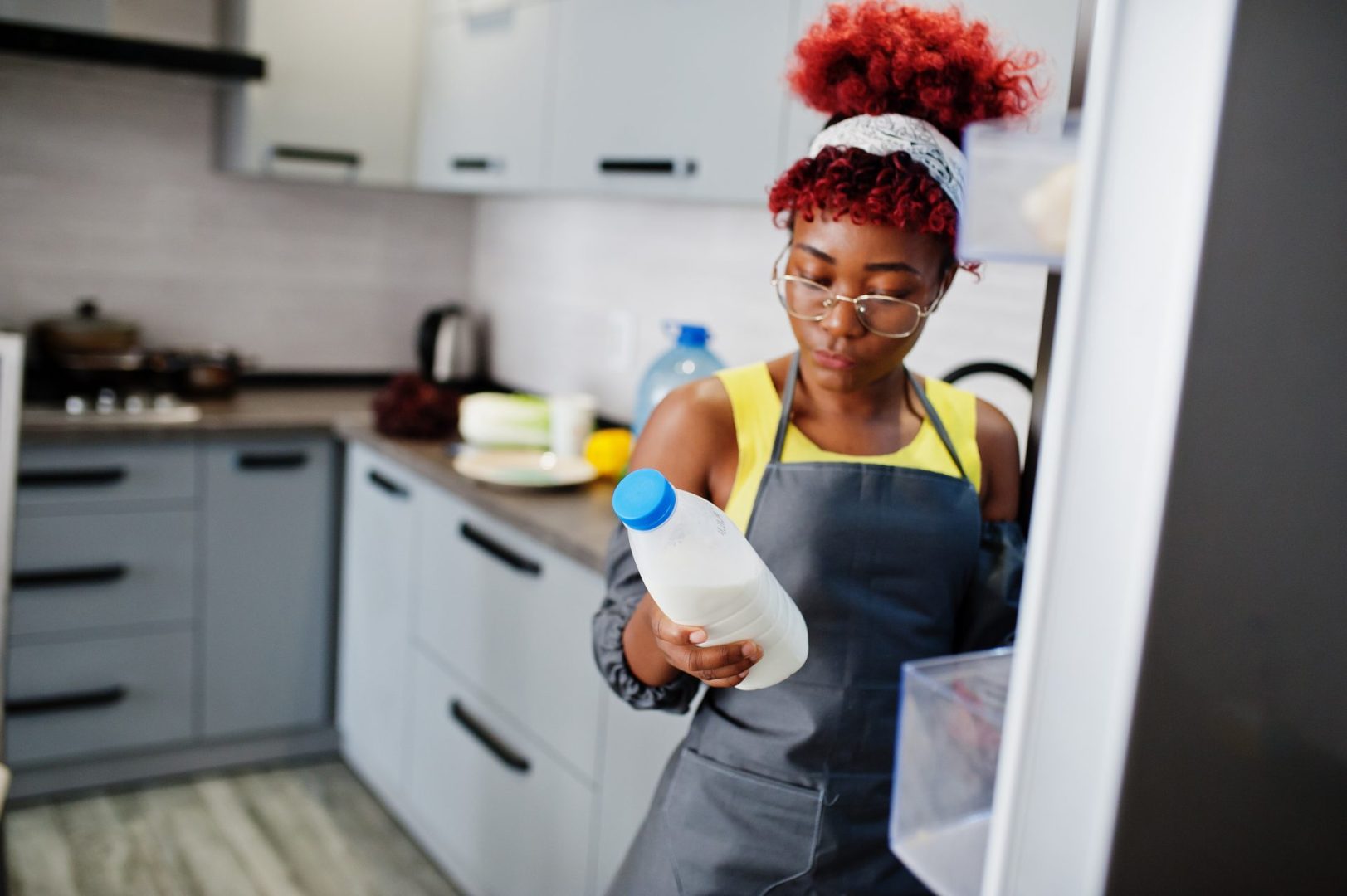 An African American woman looking at raw milk