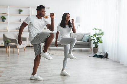 African American couple doing standing exercises