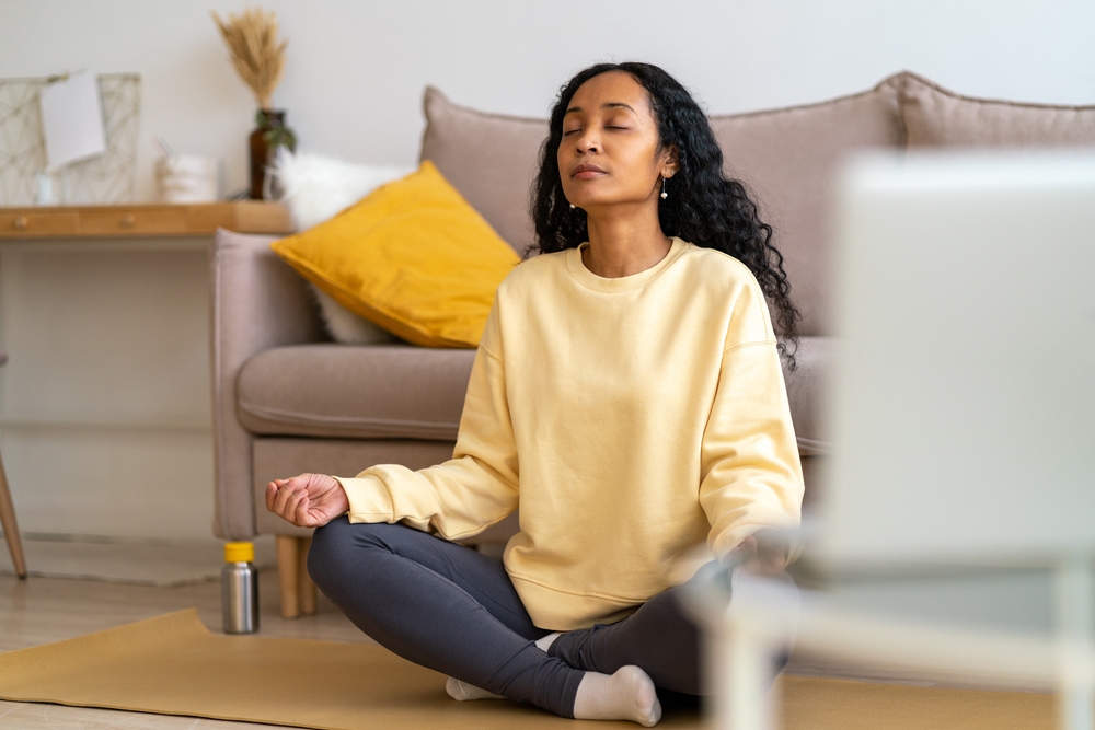 African American woman practicing breathwork techniques