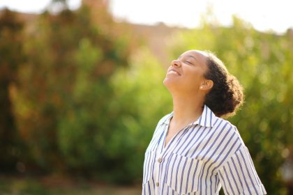 An African American woman happy that it is spring time