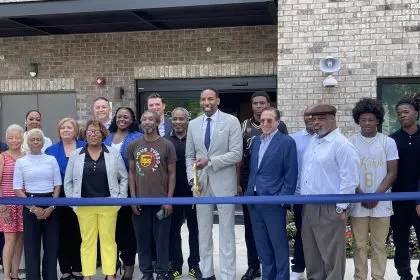 Atlanta Mayor Andre Dickens, center, cutting the ribbon
