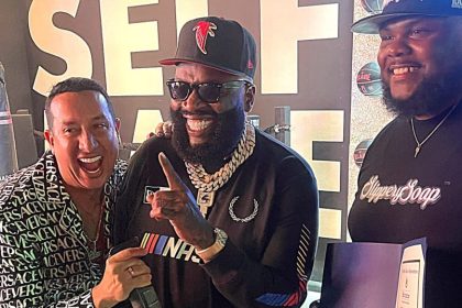 Rick Ross chops it up with friends at his car show press conference