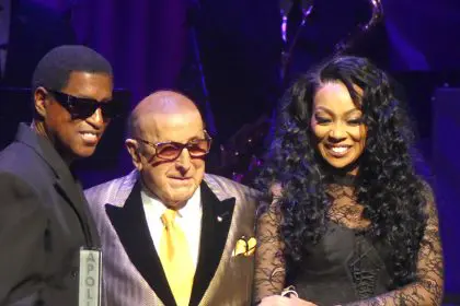 Clive Davis surrounded by Babyface and Monica while being honored at the Apollo Theater (Photo by Derrel Jazz Johnson for rolling out)